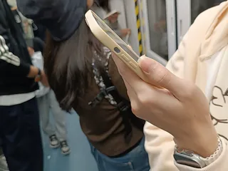 Commuter holding a smartphone